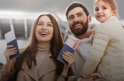 Family with passports at the airport on a family visa
